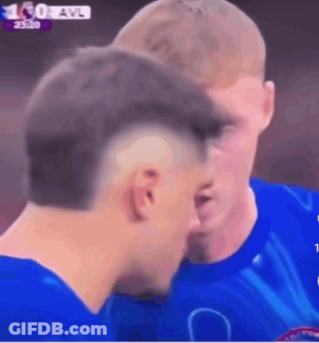 A Man In A Blue Shirt Talks To Another Man GIF