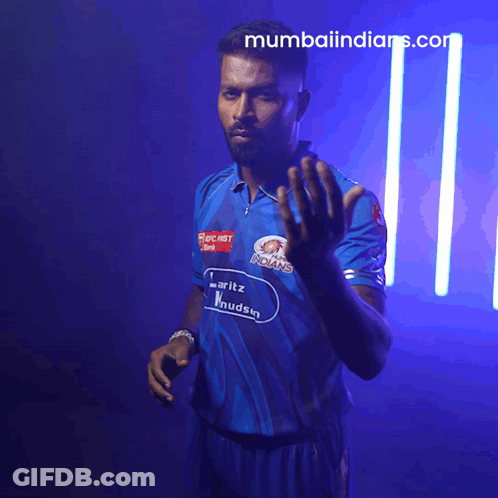 A Man In A Blue Shirt That Says Mumbai Indians GIF