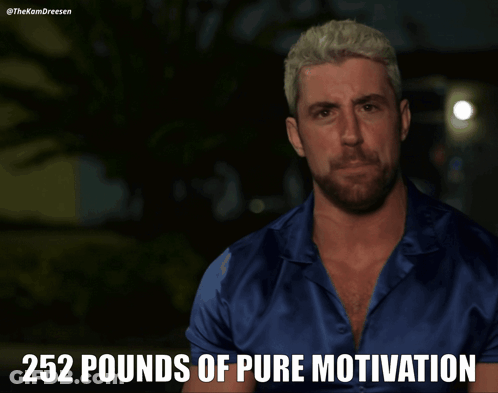A Man In A Blue Shirt With 252 Pounds Of Pure Motivation Written Above Him GIF