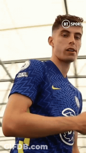 A Man In A Blue Shirt With A Bt Sport Logo On His Chest GIF