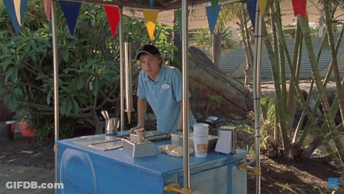 A Man In A Blue Shirt With A Name Tag That Says ' Chris ' GIF