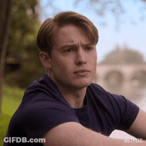 A Man In A Blue Shirt With A Netflix Logo On The Bottom GIF