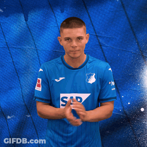 A Man In A Blue Shirt With Sap On It GIF