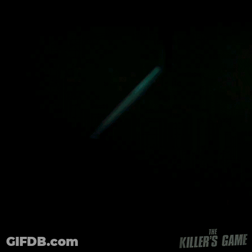 A Man In A Blue Shirt With The Killer 'S Game Written On The Front GIF