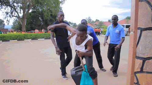 Man In Blue Shirt Holding Woman GIF