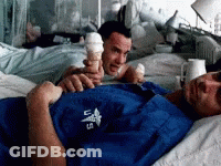 A Man In A Blue Shirt With The Letters U.s. On It Is Holding An Ice Cream Cone GIF