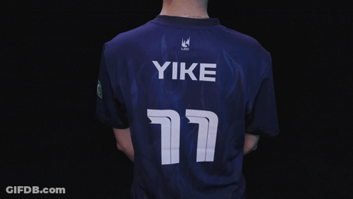 A Man In A Blue Shirt With The Name Yike On The Bottom GIF