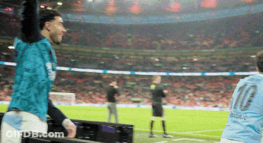 A Man In A Blue Shirt With The Number 10 On It GIF
