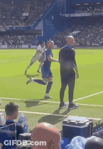 A Man In A Blue Shirt With The Number 10 On It GIF