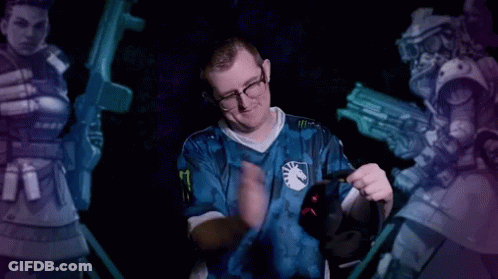 A Man In A Blue Shirt With The Number 8 On It Holds A Headset GIF
