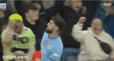 A Man In A Blue Shirt With The Word City On It Is Surrounded By A Crowd GIF
