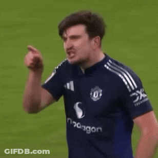 A Man In A Blue Shirt With The Word Dragon On The Front GIF