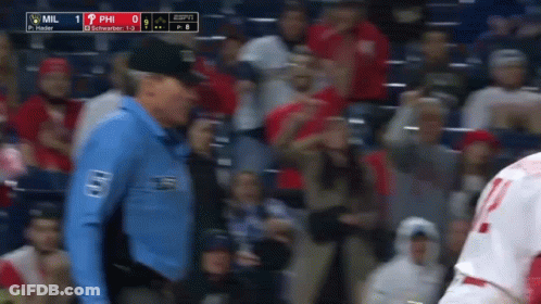 A Man In A Blue Shirt With The Word Mil On It GIF