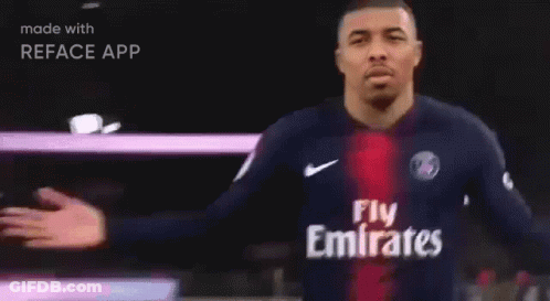 A Man In A Blue Shirt With The Word Paris On It Is Made With Reface App GIF