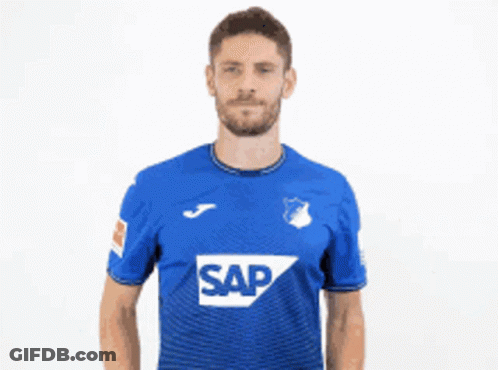 A Man In A Blue Shirt With The Word Sap On It Gives Two Thumbs Up GIF