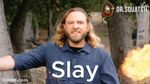 A Man In A Blue Shirt With The Word Slay On His Shirt GIF