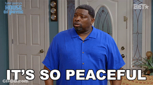 A Man In A Blue Shirt With The Words It 'S So Peaceful GIF
