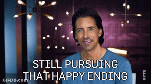 A Man In A Blue Shirt With The Words Still Pursuing That Happy Ending GIF