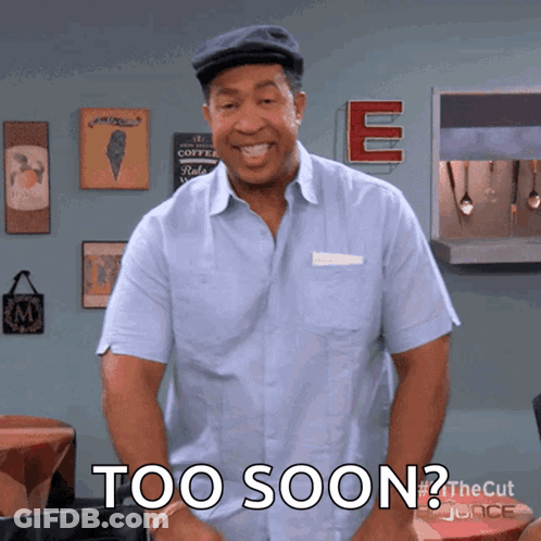 A Man In A Blue Shirt With The Words Too Soon On His Chest GIF