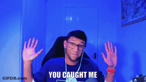 A Man In A Blue Shirt With The Words You Caught Me On It GIF