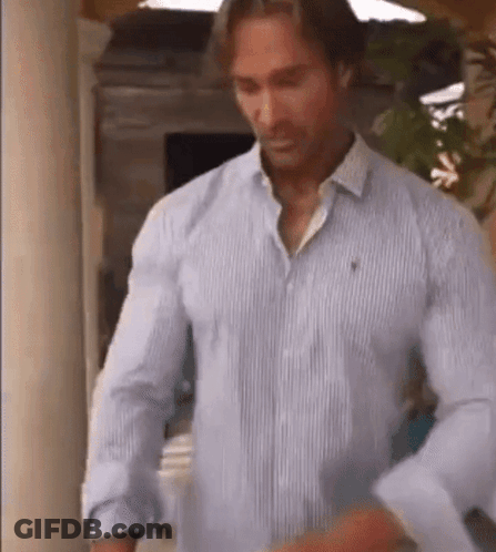 Man Adjusting Sleeves In Blue Striped Shirt GIF