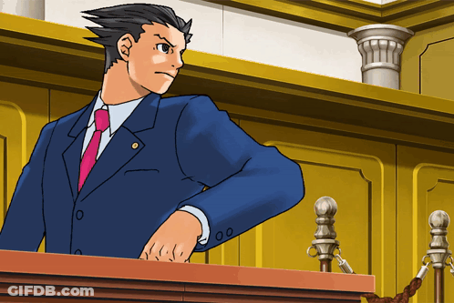 A Man In A Blue Suit And Pink Tie Stands At A Podium GIF
