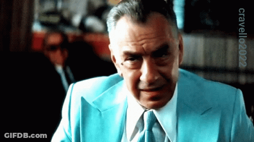 A Man In A Blue Suit And Tie Has The Year 2022 On The Bottom GIF