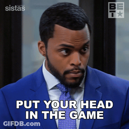 A Man In A Blue Suit And Tie Says " Put Your Head In The Game " GIF