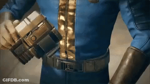 A Man In A Blue Suit Is Holding A Gun In His Hand . GIF