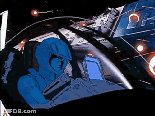 A Man In A Blue Suit Is Sitting In A Space Ship GIF