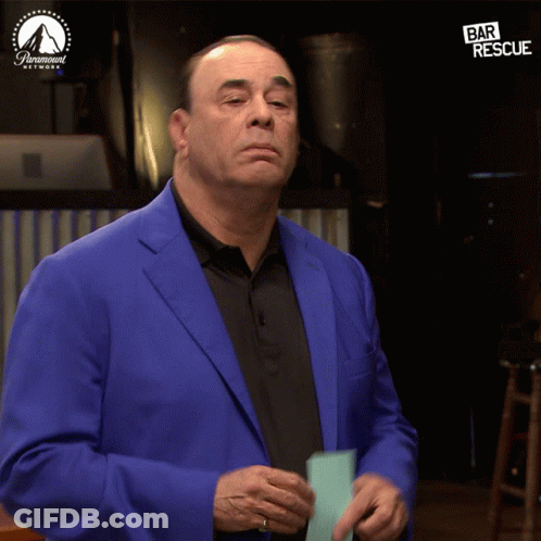 Man In Blue Suit In Front Of Bar Rescue Screen GIF