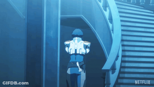 A Man In A Blue Suit Is Walking Down A Set Of Stairs With Netflix Written On The Bottom GIF
