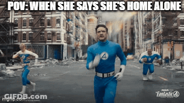 A Man In A Blue Superhero Costume Is Running Down A City Street GIF