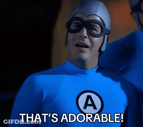 A Man In A Blue Superhero Costume Says " That 'S Adorable " GIF