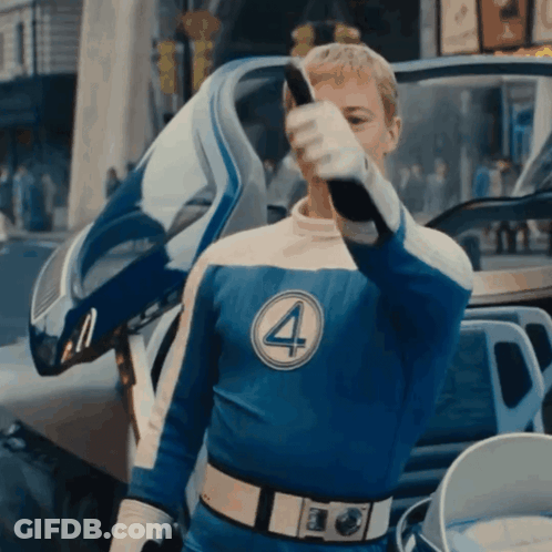 A Man In A Blue Superhero Costume With The Number Four On His Chest GIF