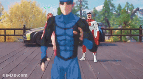 A Man In A Blue Superhero Suit Is Standing On A Deck GIF
