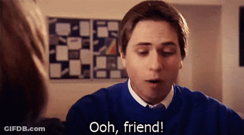 A Man In A Blue Sweater Is Talking To A Woman And Says Ooh Friend GIF