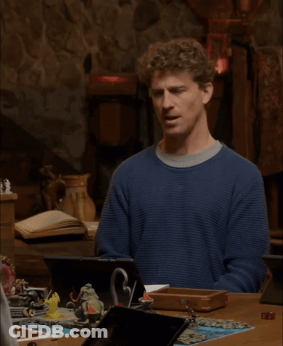 A Man In A Blue Sweater Says I 'M Sorry What GIF
