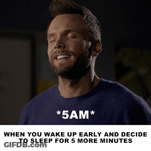 A Man In A Blue Sweater With His Eyes Closed And The Words * 5Am * Below Him GIF
