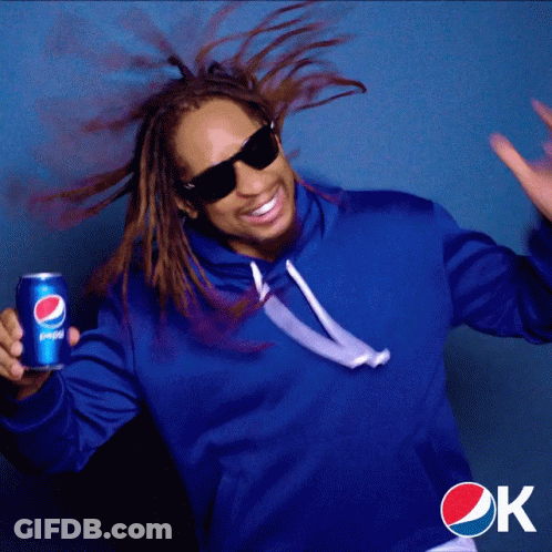 A Man In A Blue Sweatshirt Holds A Can Of Pepsi GIF