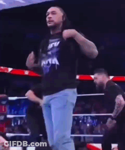 A Man In A Blue T-Shirt That Says New York Is Dancing In A Ring GIF
