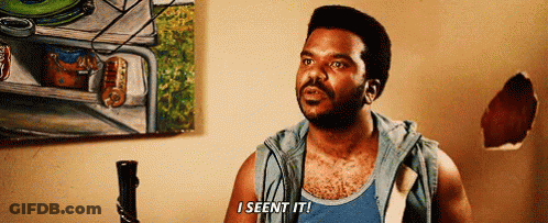A Man In A Blue Tank Top Says I Seen It In Front Of A Painting GIF