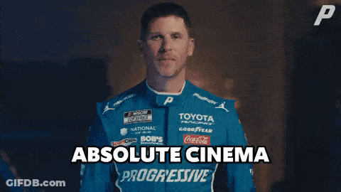 A Man In A Blue Toyota Racing Suit Is Giving A High Five GIF