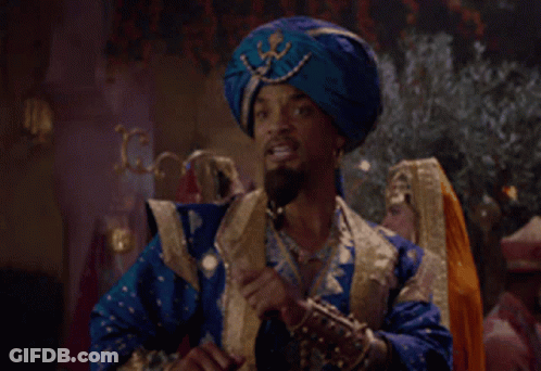 A Man In A Blue Turban Is Talking On A Cell Phone GIF