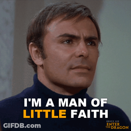 A Man In A Blue Turtleneck Sweater Says I 'M A Man Of Little Faith GIF