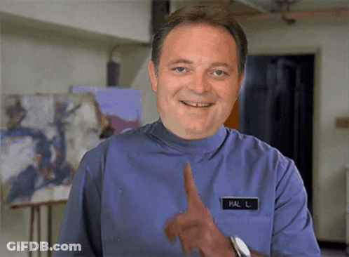 A Man In A Blue Uniform Has A Name Tag That Says Mal L On It GIF