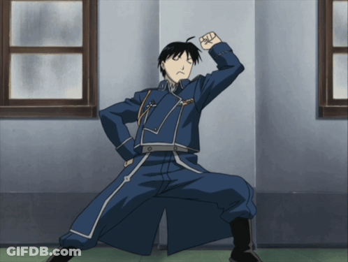 A Man In A Blue Uniform With A Fist In The Air GIF