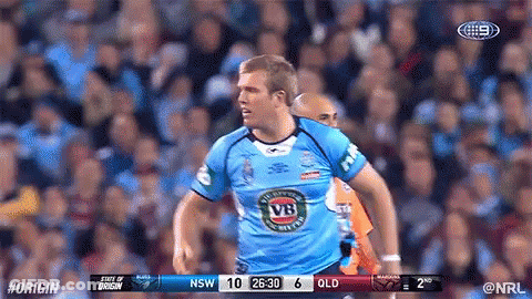 A Man In A Blue Vb Jersey Stands In Front Of A Crowd During A Rugby Game GIF