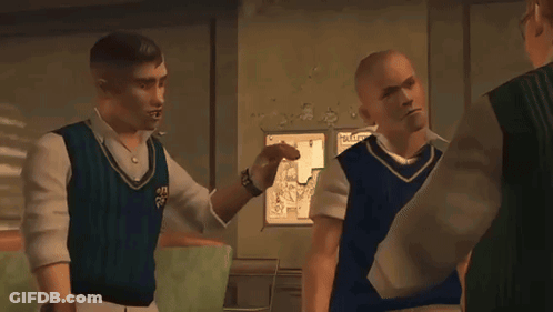 A Man In A Blue Vest Talks To Two Other Men GIF