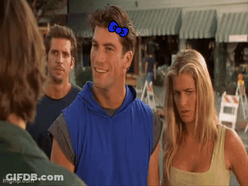 Man In Blue Vest Talking To Woman In Yellow Tank Top GIF